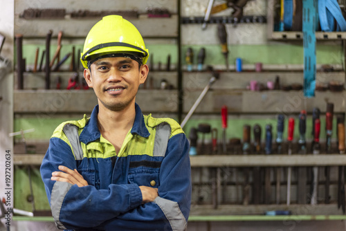 Fotografía Close portrait of a marine engineer in protective clothing working in an industrial maritime environment