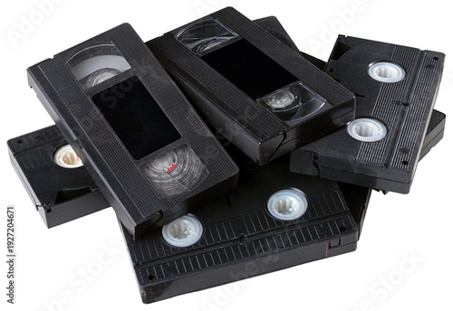 Several VHS tapes lying in a loose stack. Isolated background.
