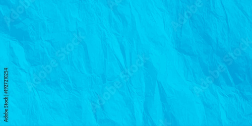 vibrant cyan crumpled paper texture background, bright blue wrinkled paper surface with folds and creases