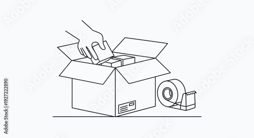 Hand packing items into a cardboard box with tape dispenser
