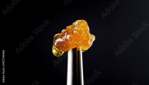 Live Rosin On A Dab Tool With A Black Background
