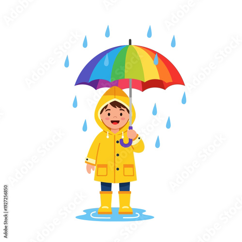 Happy child in yellow raincoat holding rainbow umbrella in rain