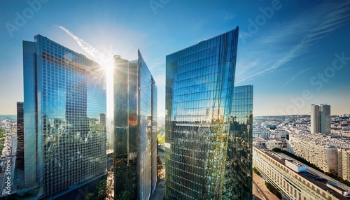 modern architecture skyline of office towers with glass reflection and geometric facade in la defense district of paris france under bright daylight urban city atmosphere