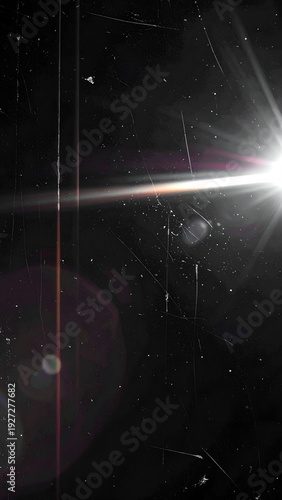 Vertical shot of a bright light source with streaks and scratches