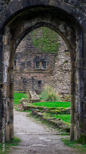 Whalley Abbey old, ancient ruins. Remains of the Cistercian abbey. A stone arche leading to the inner courtyard