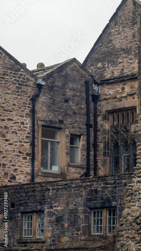 Whalley Abbey ancient, old, ruins. An old, medieval building with windows on a cloudy day, close-up