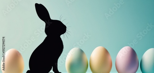 black rabbit silhouette with pastel easter eggs on blue, banner, concept of holiday, retail