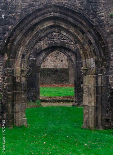 Whalley Abbey old, ancient ruins. Remains of the Cistercian abbey. A series of stone arches leading to the inner courtyard