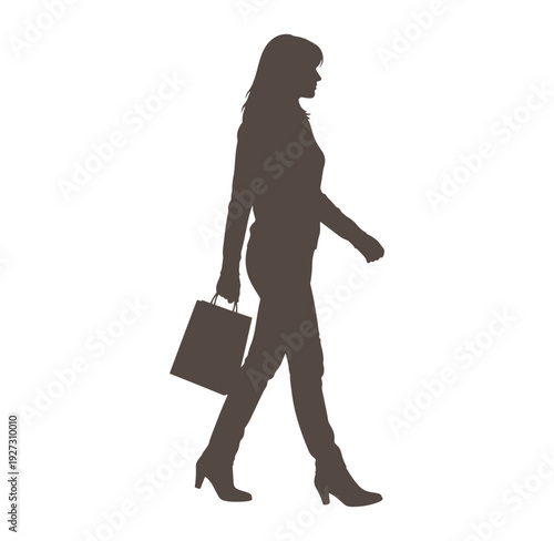 silhouette of a woman walking with a shopping bag in her hand