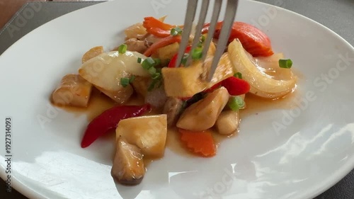 Eating Vegetarian Stir Fried Tofu and Mushrooms in Tamarind Sauce