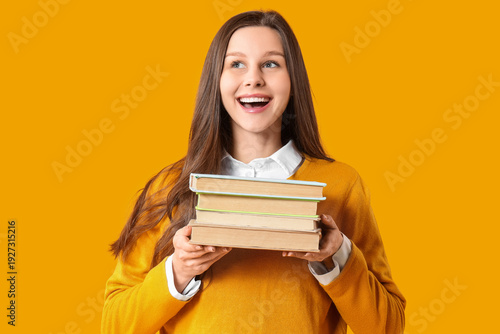 Happy young woman with stac...
