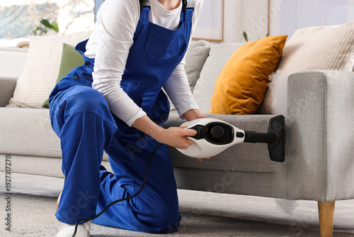 Female janitor steam cleani...