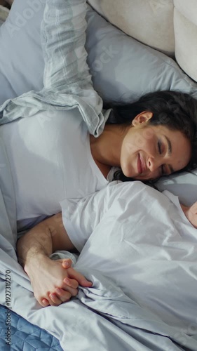 Happy Caucasian couple man woman sleeping together on bed home bedroom daydream lovers sleep cozy wake up weekend rest napping soft mattress apartment wife husband sweetheart intimacy hugging marriage