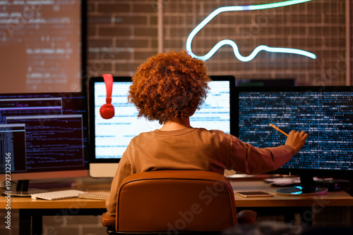 Young female programmer wor...