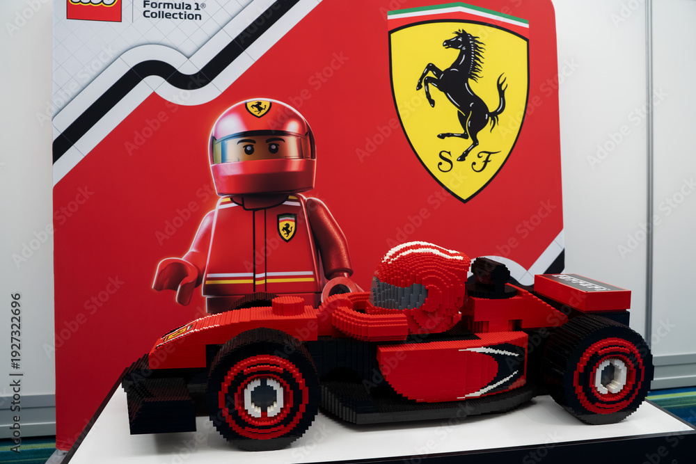 Fototapeta premium LEGO Ferrari Formula style race car model with driver figure display. Toronto, Canada - February 18, 2026.