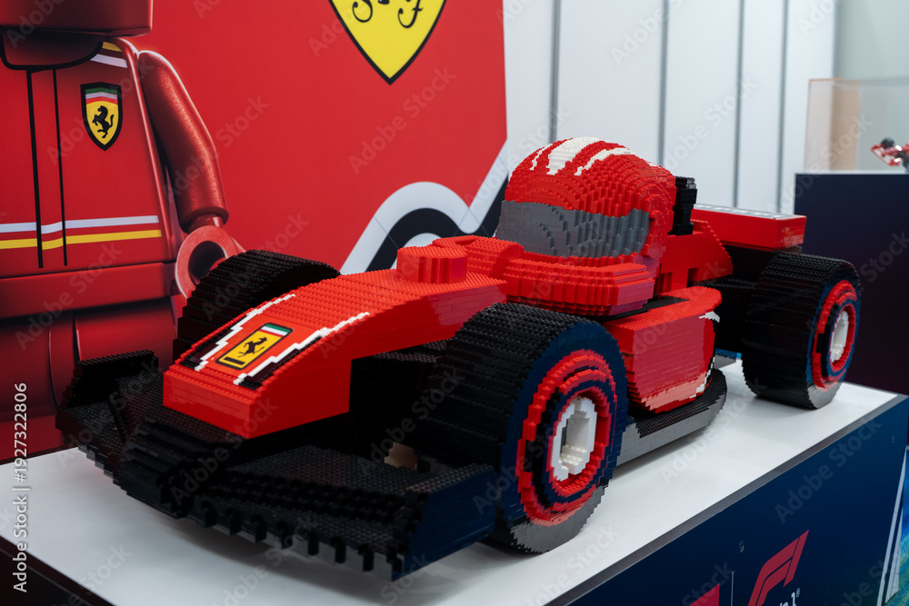 Fototapeta premium LEGO Ferrari Formula style race car model with driver figure display. Toronto, Canada - February 18, 2026.