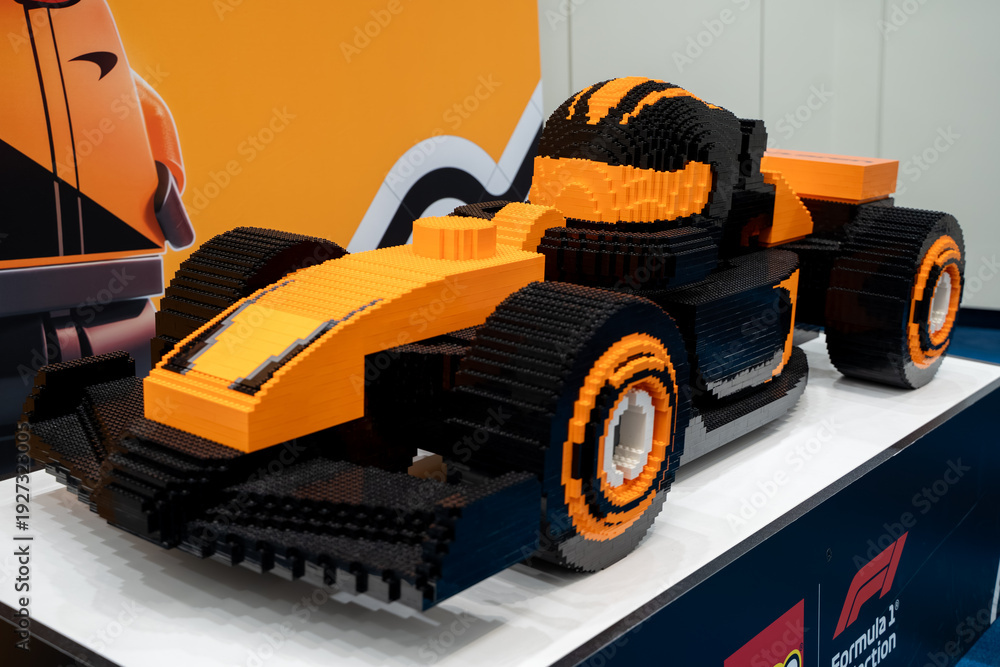 Naklejka premium LEGO McLaren Formula 1 race car model with driver figure display. Toronto, Canada - February 18, 2026.