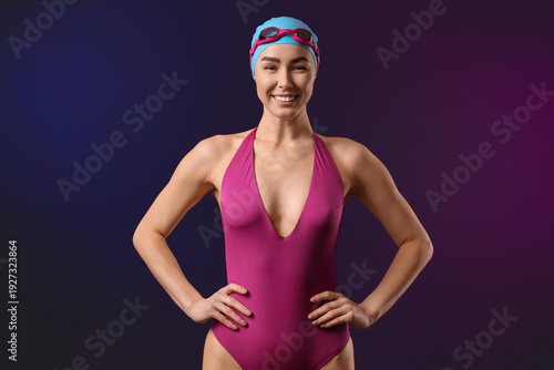 Young female swimmer on dar...