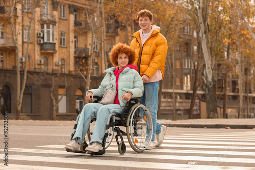 Young woman in wheelchair w...