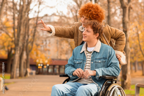 Young man in wheelchair wit...