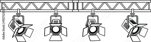 Four stage lights mounted on a metal truss for theater or concert lighting design