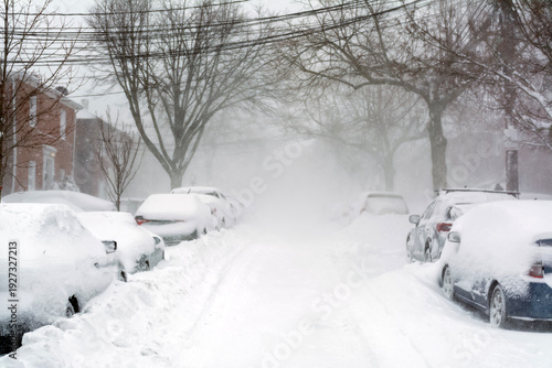 фотографія Severe winter snowstorm burying cars on Brighton Massachusetts street