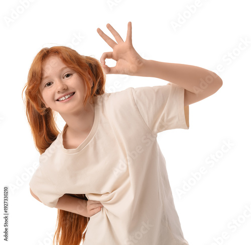 Teenage redhead girl showin...