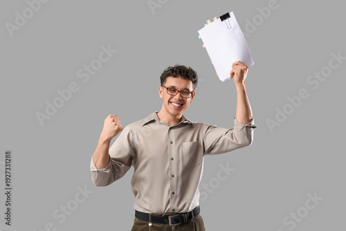 Happy male screenwriter wit...