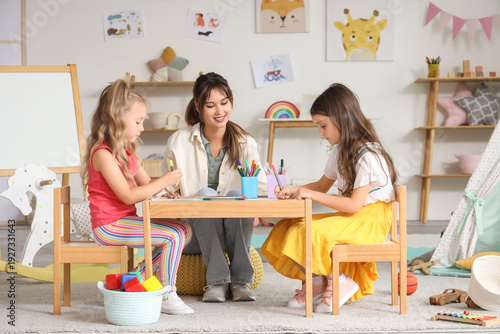 Little girls with nursery t...