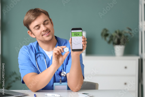Male doctor with glucose se...