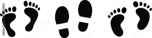 Set of black human footprints silhouettes isolated on gray background walking track icon collection