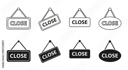 Collection of various 'Close' signs in different shapes and orientations hanging from hooks on a plain background