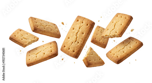 Levitating golden butter biscuits with crumbs isolated on white background