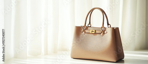 Elegant Textured Handbag with Gold Buckle on Soft Light Background
