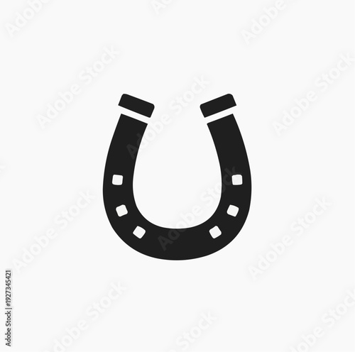 Bold black silhouette of a traditional horseshoe, widely recognized as a powerful symbol of good luck.