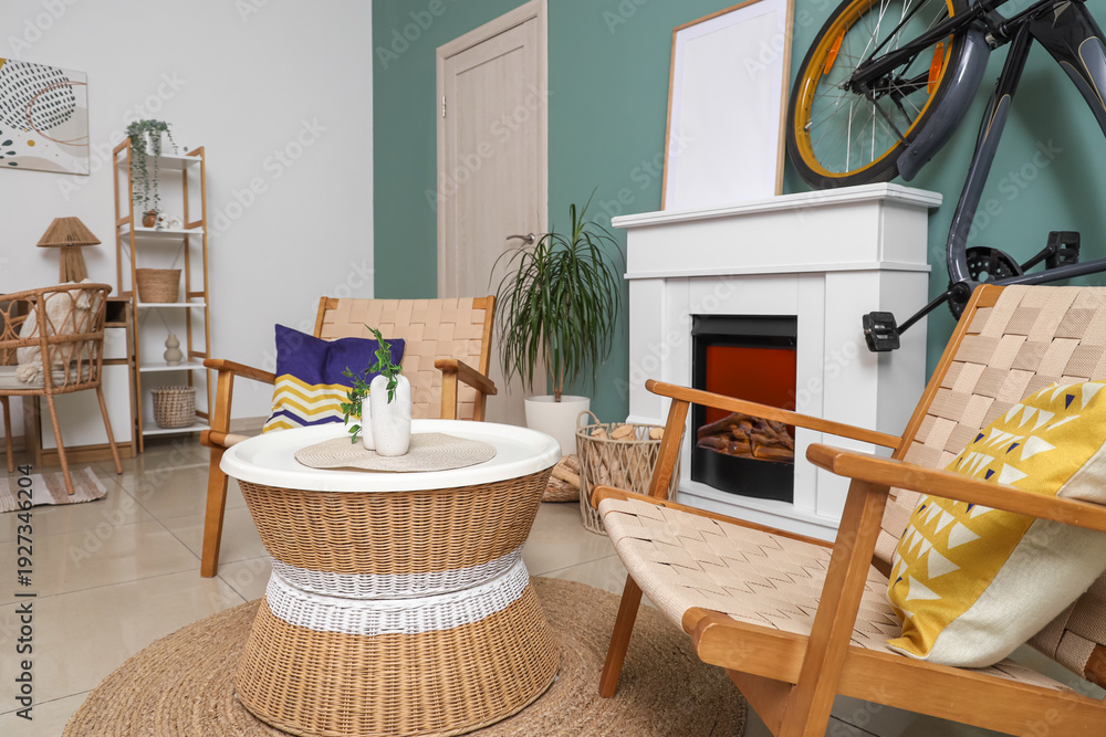 Naklejka premium Interior of living room with bicycle, fireplace and armchairs