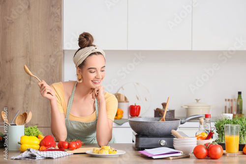 Young woman with spoon and ...
