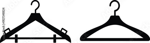 Two black plastic coat hangers with hooks on for clothing storage and organization