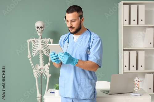 Male doctor in AR glasses u...