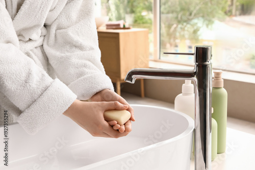 Woman washing her hands wit...