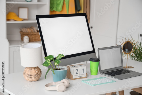 Stylish workplace with mode...