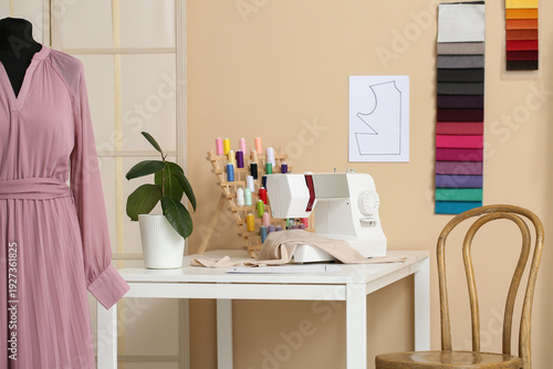 Tailor's workplace with sew...