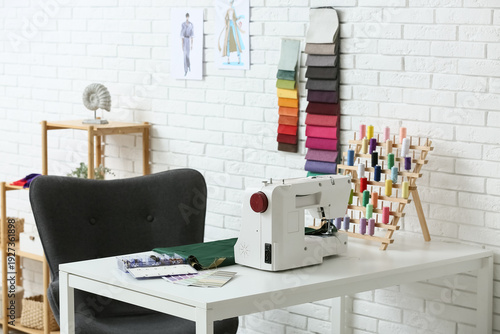 Tailor's workplace with sew...