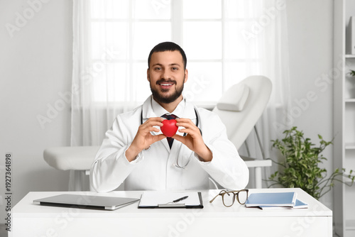 Young happy male doctor wit...