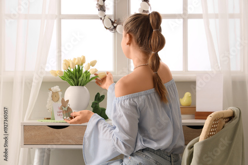 Young woman and vase with t...