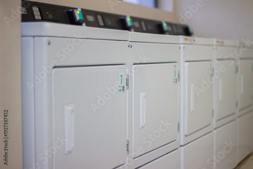 Wallpaper Mural Row of self service dryers in modern laundromat Torontodigital.ca