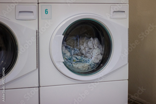 Wallpaper Mural Laundry inside front loading washing machine in self service laundromat Torontodigital.ca