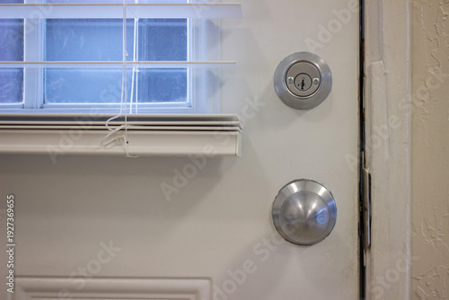 Wallpaper Mural Metal door lock and round doorknob on entrance door Torontodigital.ca