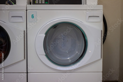 Wallpaper Mural Laundry spinning inside tumble dryer in self service laundromat close up Torontodigital.ca