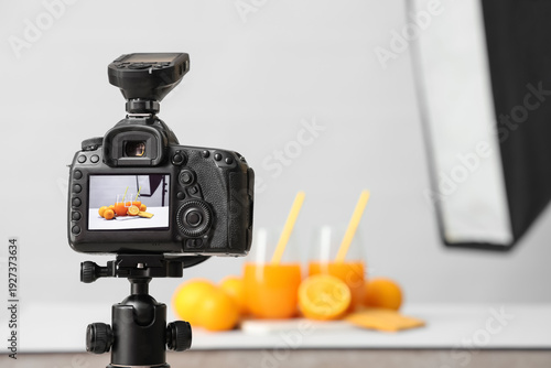 Oranges with juice on camer...